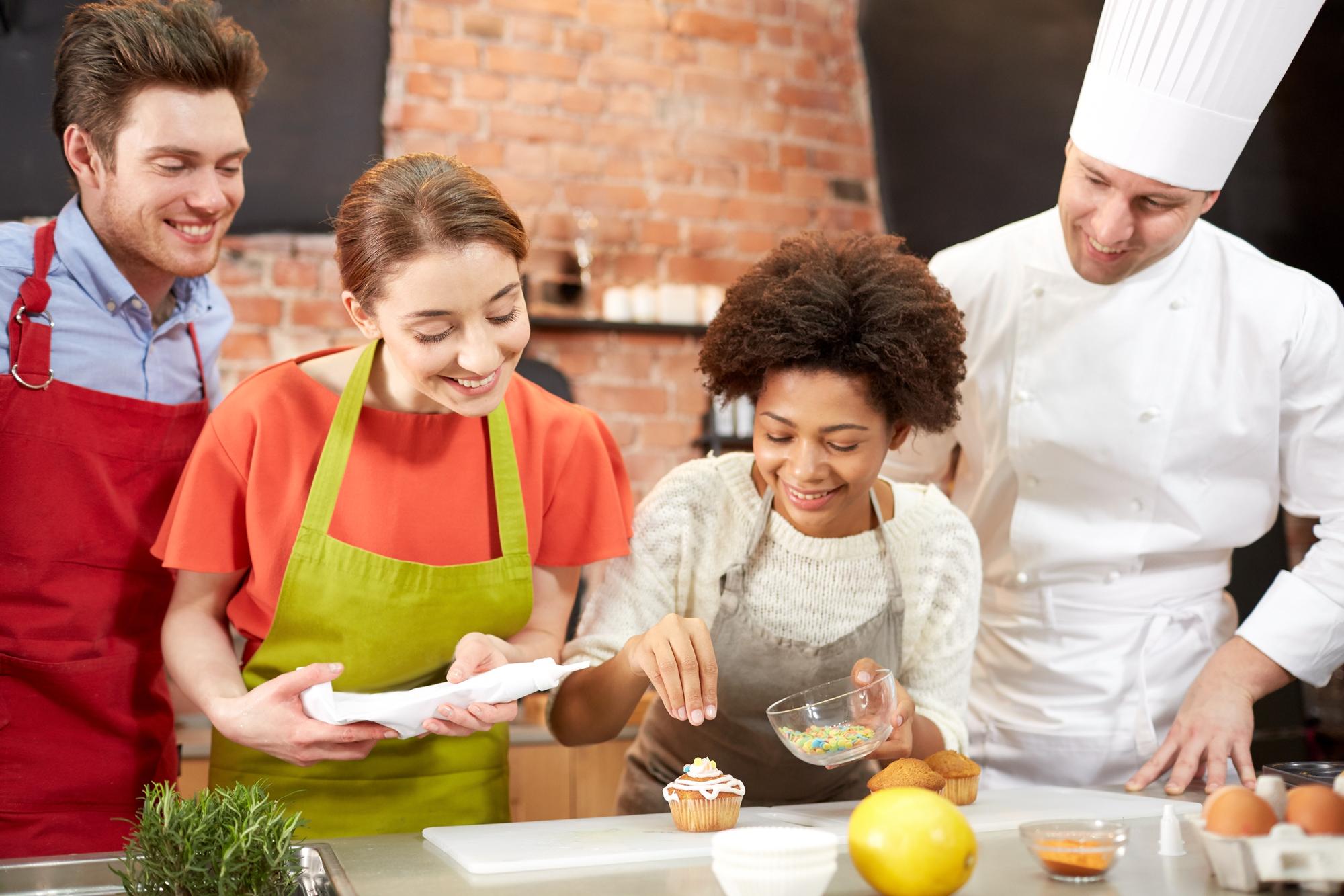 Students working around a chef's station